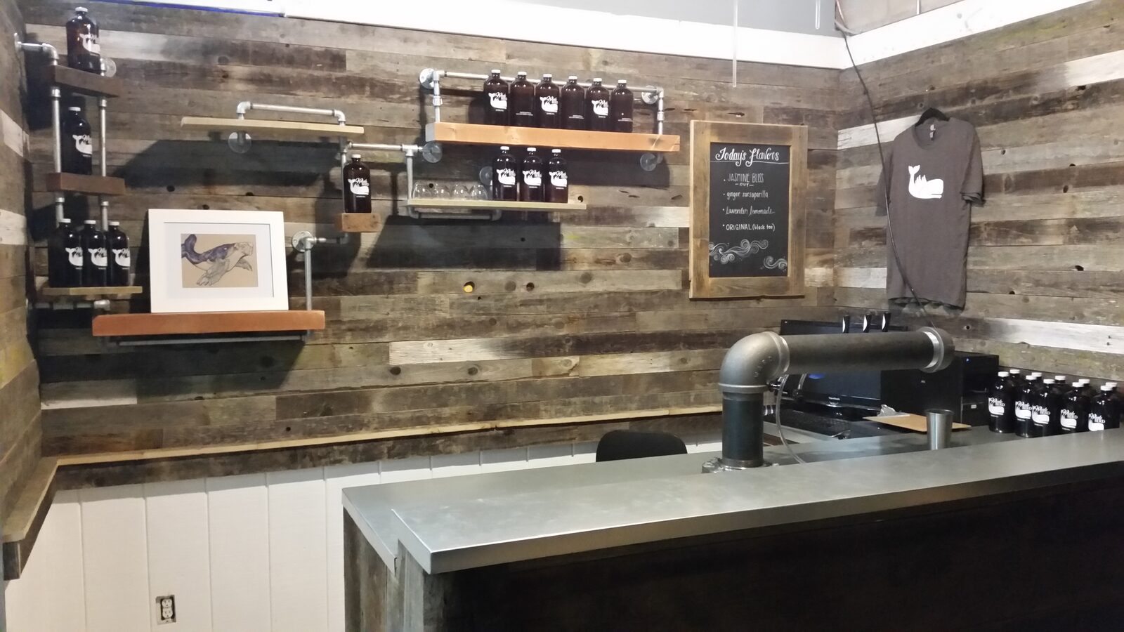 Pipe shelving and chalkboard menu