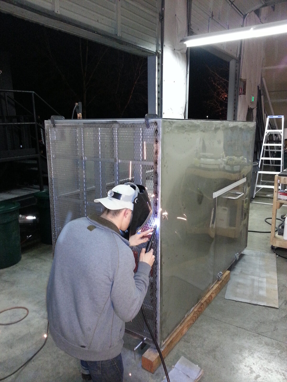 Night welding on the stainless enclosure
