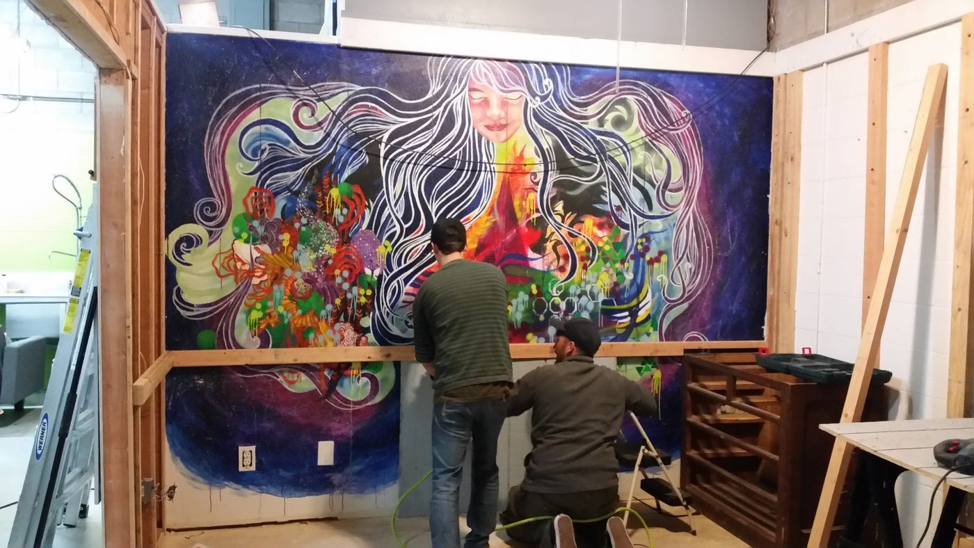 Framing the tasting room walls in front of the mural a local artist painted for us